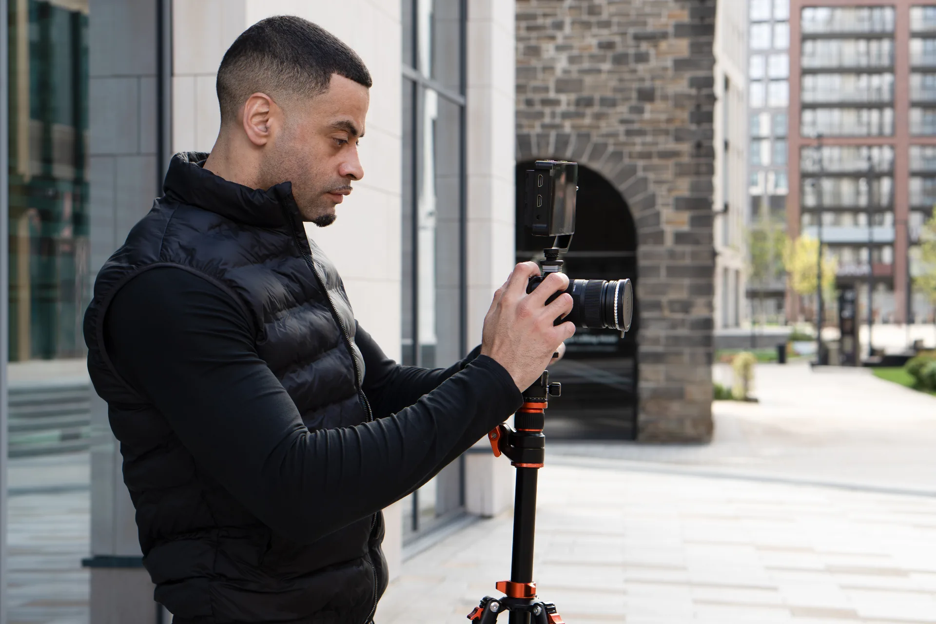 Clinton on location with camera and tripod